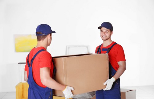 Removal van and moving crew handling a local move in Merton