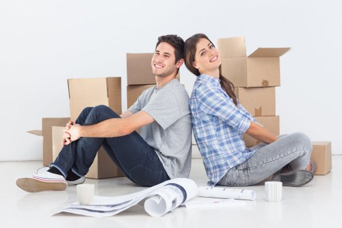 Commercial movers handling desks and equipment during an office relocation