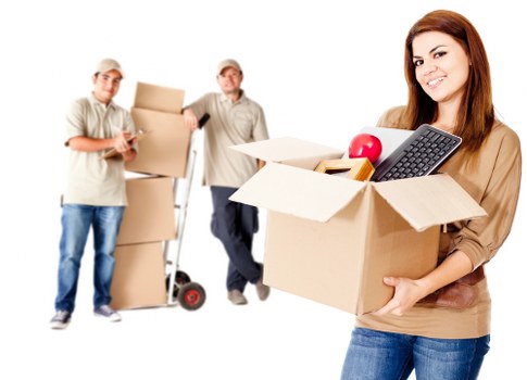 Packed boxes and student furniture prepared for transport in Merton